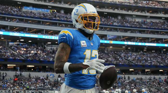 Chargers wide receiver Keenan Allen holds onto a ball in a game.